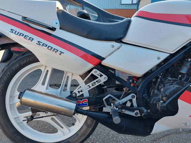 Honda NS125R Exhaust Hanger Bracket